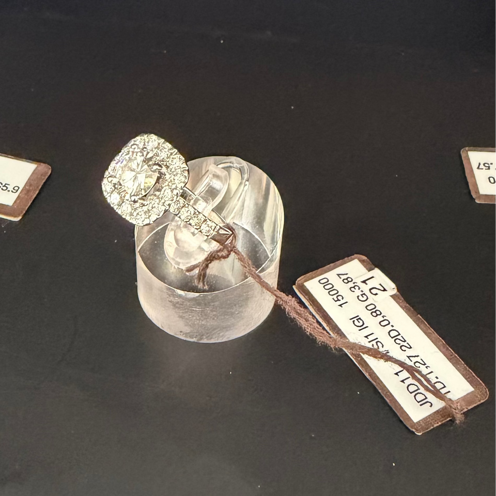 Solitaire ring with diamond halo