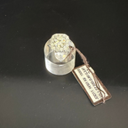 Solitaire ring with diamond halo