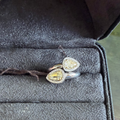 Open ring with two teardrop stones and diamonds