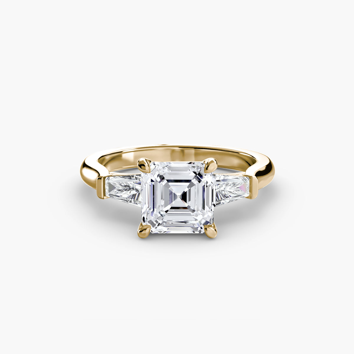 Anello Trilogy con Baguette Laterali