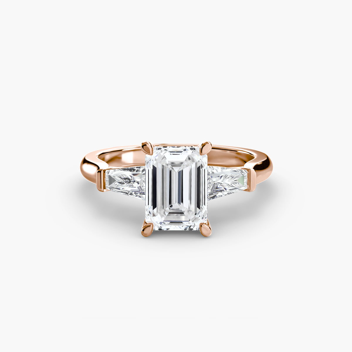 Anello Trilogy con Baguette Laterali
