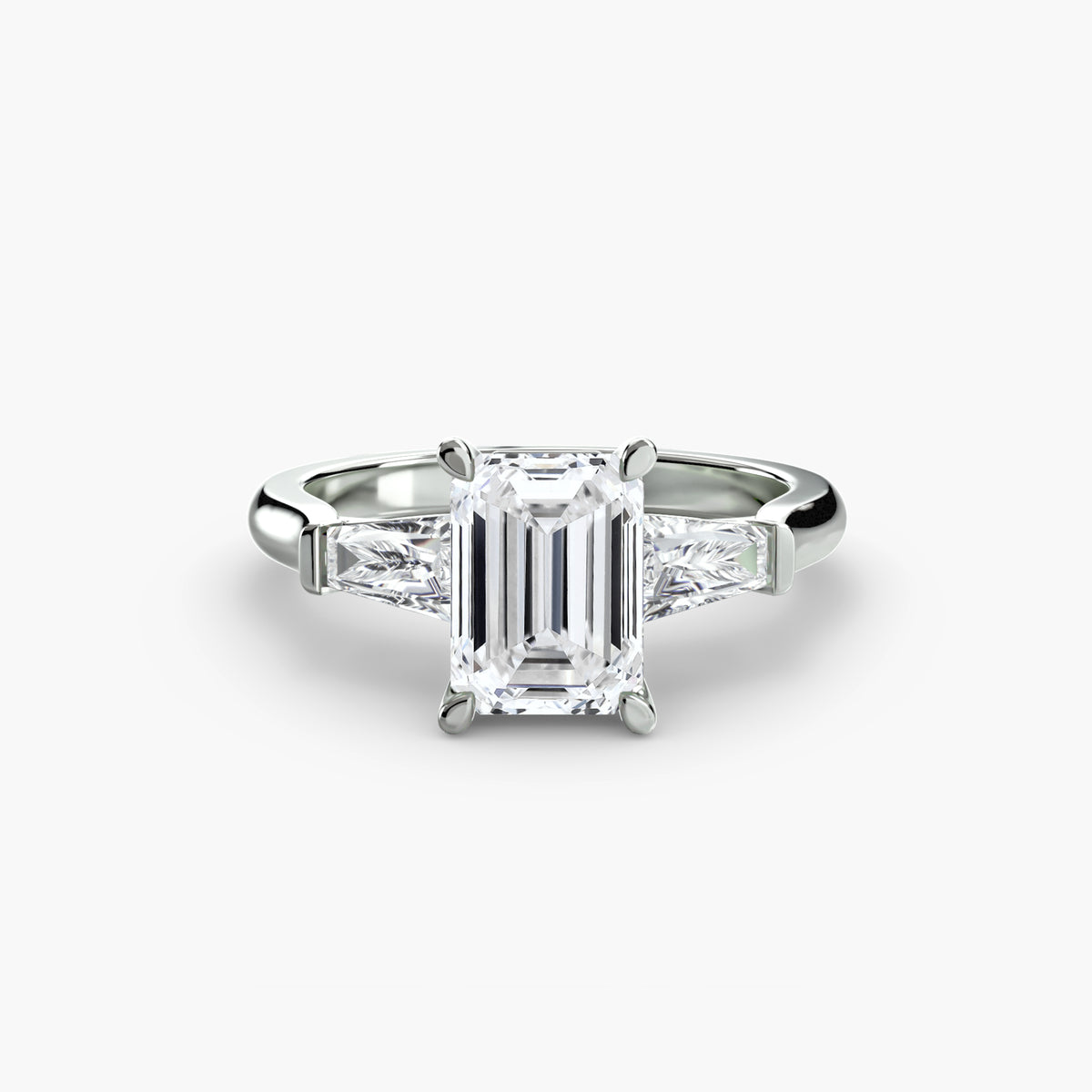 Anello Trilogy con Baguette Laterali