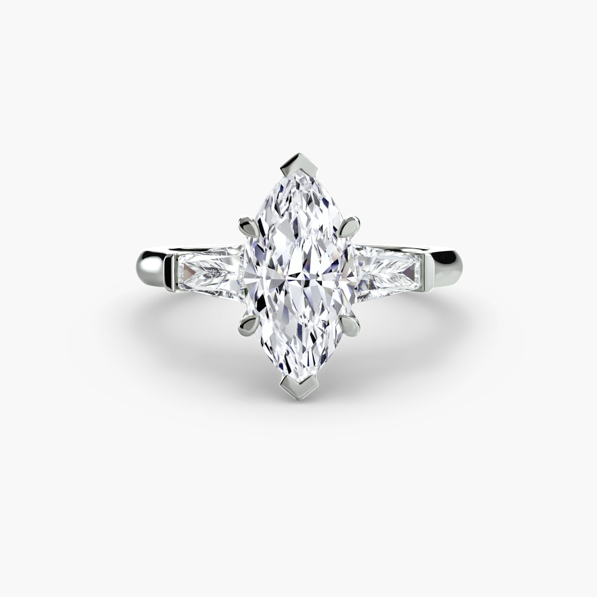 Anello Trilogy con Baguette Laterali
