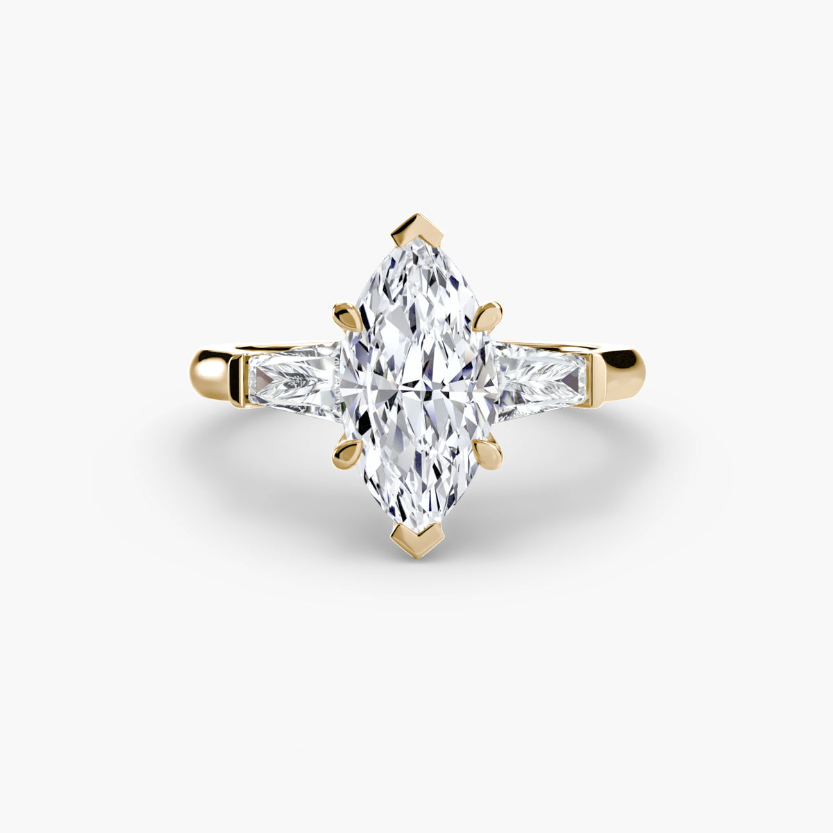 Anello Trilogy con Baguette Laterali