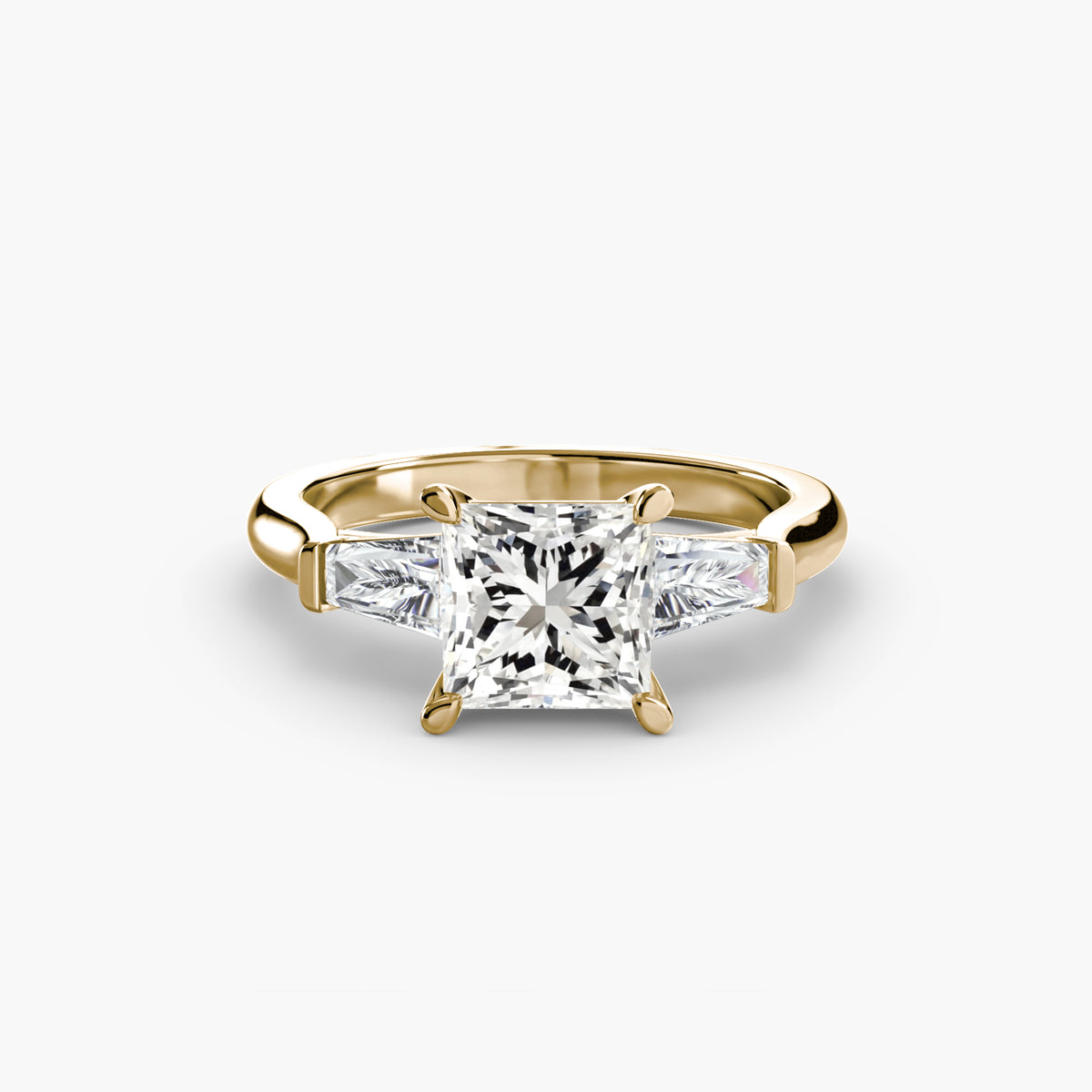 Anello Trilogy con Baguette Laterali